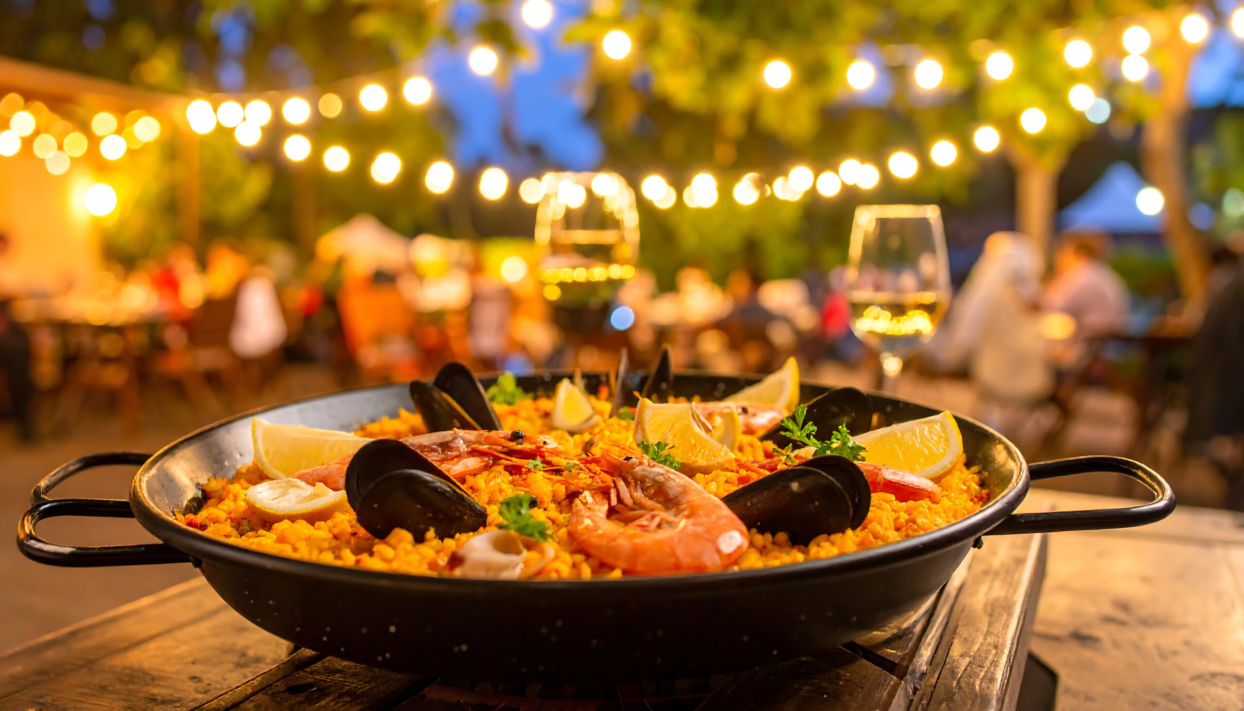 Live paella station and tapas spread at a Spanish-themed event in the Bay Area by PSRT
